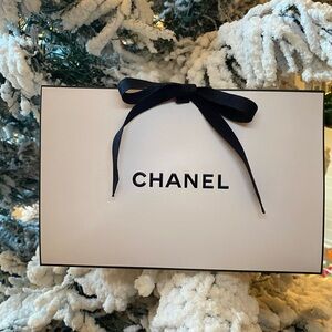 CHANEL Gift Packaging With Paper Shred and Ribbon Closure